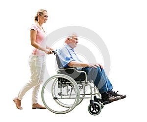 Happy Woman Assisting Her Disabled Father On Wheelchair