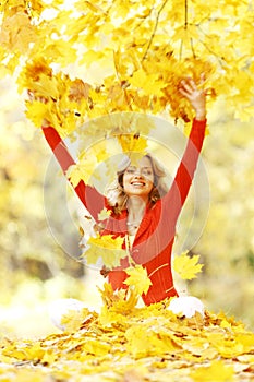 Happy woman in autumn park