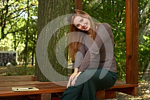 Happy woman in the autumn park