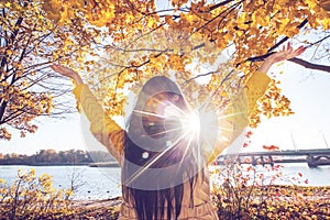 Happy woman in autumn park