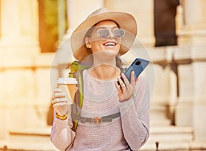 Happy woman, backpack and phone call in travel, sightseeing or city adventure and voice message, recording or coffee