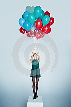 Happy woman with balloons