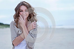 Happy woman on the beach.