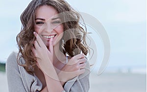 Happy woman on the beach.