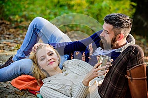 Happy woman and bearded man drink mulled wine. camping and hiking. cheers. love date and romance. Family picnic. Love