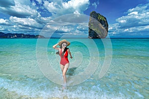 Happy woman in bikini on Poda island, Thailand. photo