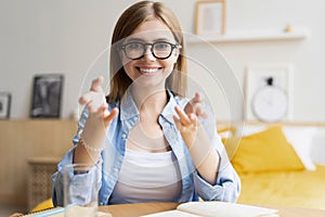 Happy woman blogger applicant teacher sit at home office look at camera doing online job interview during video chat