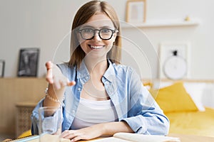 Happy woman blogger applicant teacher sit at home office look at camera doing online job interview during video chat