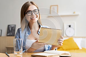 Happy woman blogger applicant teacher sit at home office look at camera doing online job interview during video chat