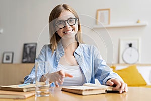 Happy woman blogger applicant teacher sit at home office look at camera doing online job interview during video chat