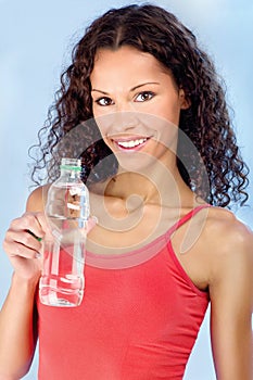 Happy woman and bottle of water