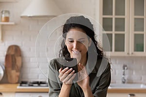 Happy woman browse internet on modern smartphone