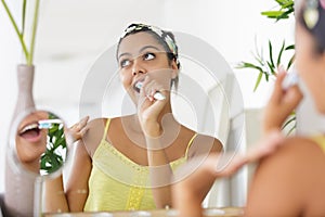 happy woman brushing teeth