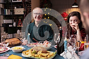 Happy woman celebrating christmas with family, laughing