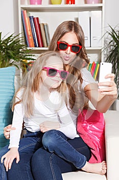 Happy woman and child taking a selfie