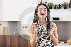 Happy woman clapping, stunning kitchen, support, box braids, hea