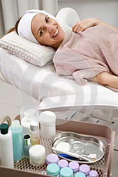 Happy woman, cleaning skin procedure in aesthetic clinic
