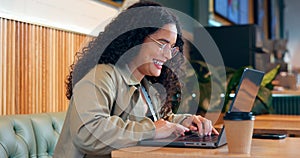 Happy woman in coffee shop, typing on computer and remote work, reading email or writing blog, article or search on