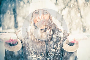 Happy woman at cold snowy winter at New York Park
