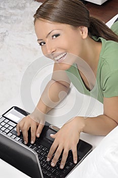 Happy woman with a computer