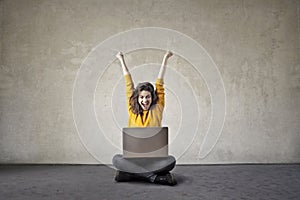 Happy woman with a computer