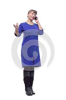 Happy woman in conversation using mobile phone and smiling