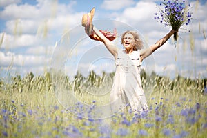 Happy woman in corn field