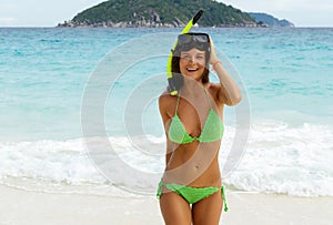 Happy woman in crochet bikini during snorkeling
