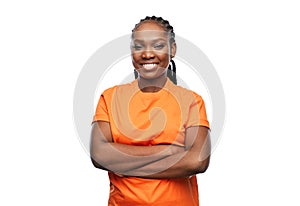 happy woman with crossed arms over white