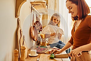 happy woman cutting vegetables preparing breakfast