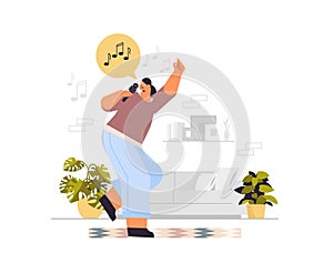 happy woman dancing and singing songs in microphone girl having fun living room interior horizontal