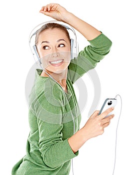 Happy woman dancing to her music