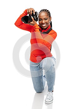 happy woman with digital camera photographing