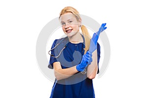 Happy woman doctor in blue scrubs and gloves