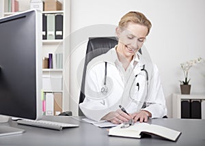 Happy Woman Doctor Making Medical Reports on Table