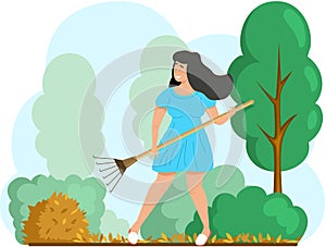 Happy woman doing garden work, remove yellow leaves, works on yard. Agricultural worker in autumn