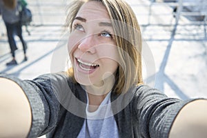 Happy woman doing selfie outdoor