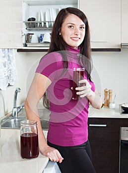 Happy woman drinking fruit-drink