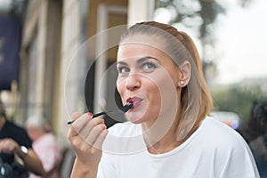 Happy woman eat with fork in restaurant in paris, france