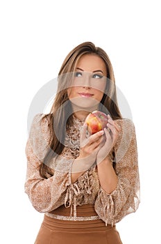 Happy woman eating an apple