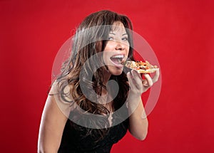 Happy woman eating pizza photo