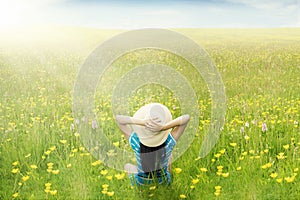 Happy woman enjoy springtime on meadow