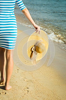 Happy woman enjoying beach relaxing joyful in summer by tropical