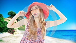 Happy woman enjoying beach relaxing joyful in summer by tropical blue water and beach. Beautiful model happy on travel wearing