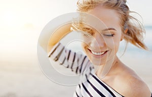 Happy woman enjoying freedom and laughs on sea