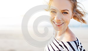 Happy woman enjoying freedom and laughs on sea photo