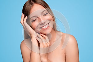 Happy woman enjoying skin softness