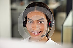 Happy, woman and face at call centre for telemarketing, customer service and client assistance in closeup. Excited