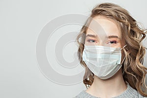 Happy woman in face mask on white background, female face close up