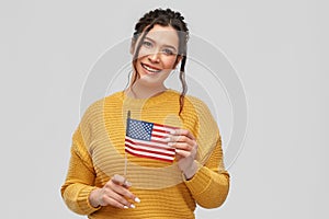 Happy woman with flag of united states of america